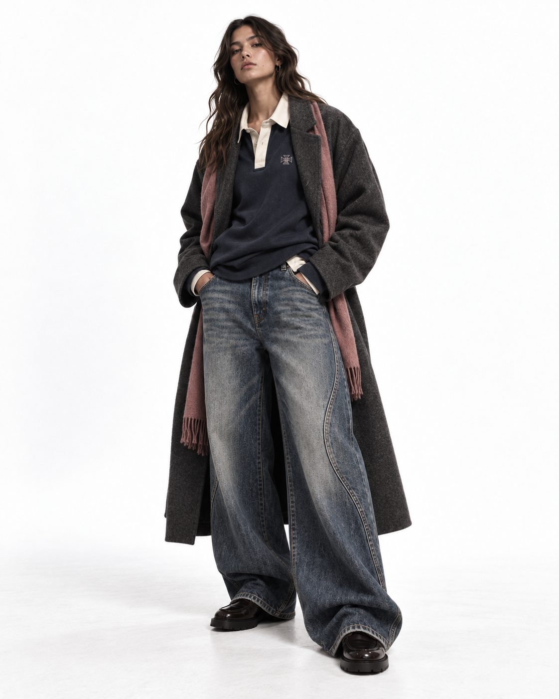 Fashion editorial with a model in a long wool coat and wide jeans